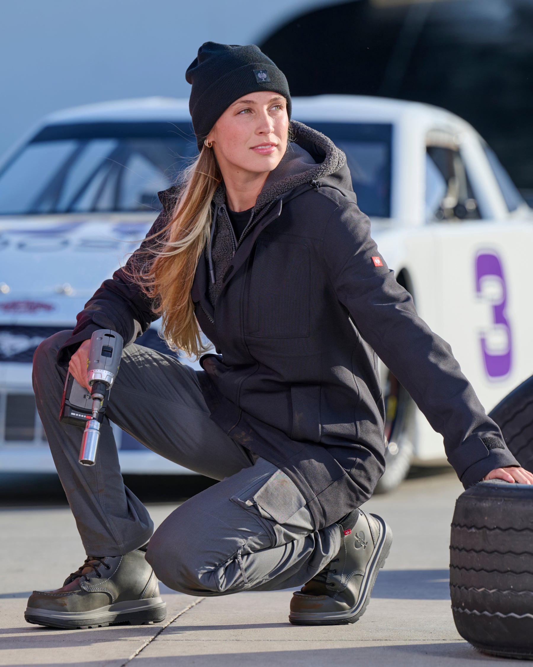 STRAUSS women's e.s.e:pic waterproof rain coat in black paired with workwear