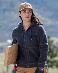 STRAUSS women's e.s.e:pic hooded sherpa fleece jacket in carbon gray worn in a work setting