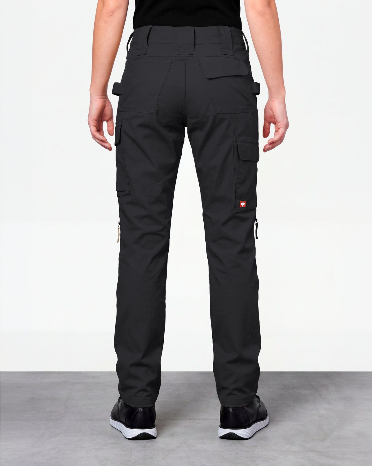 Women's Ripstop Cargo Work Pants e.s.e:pic in black worn by a model, rear view