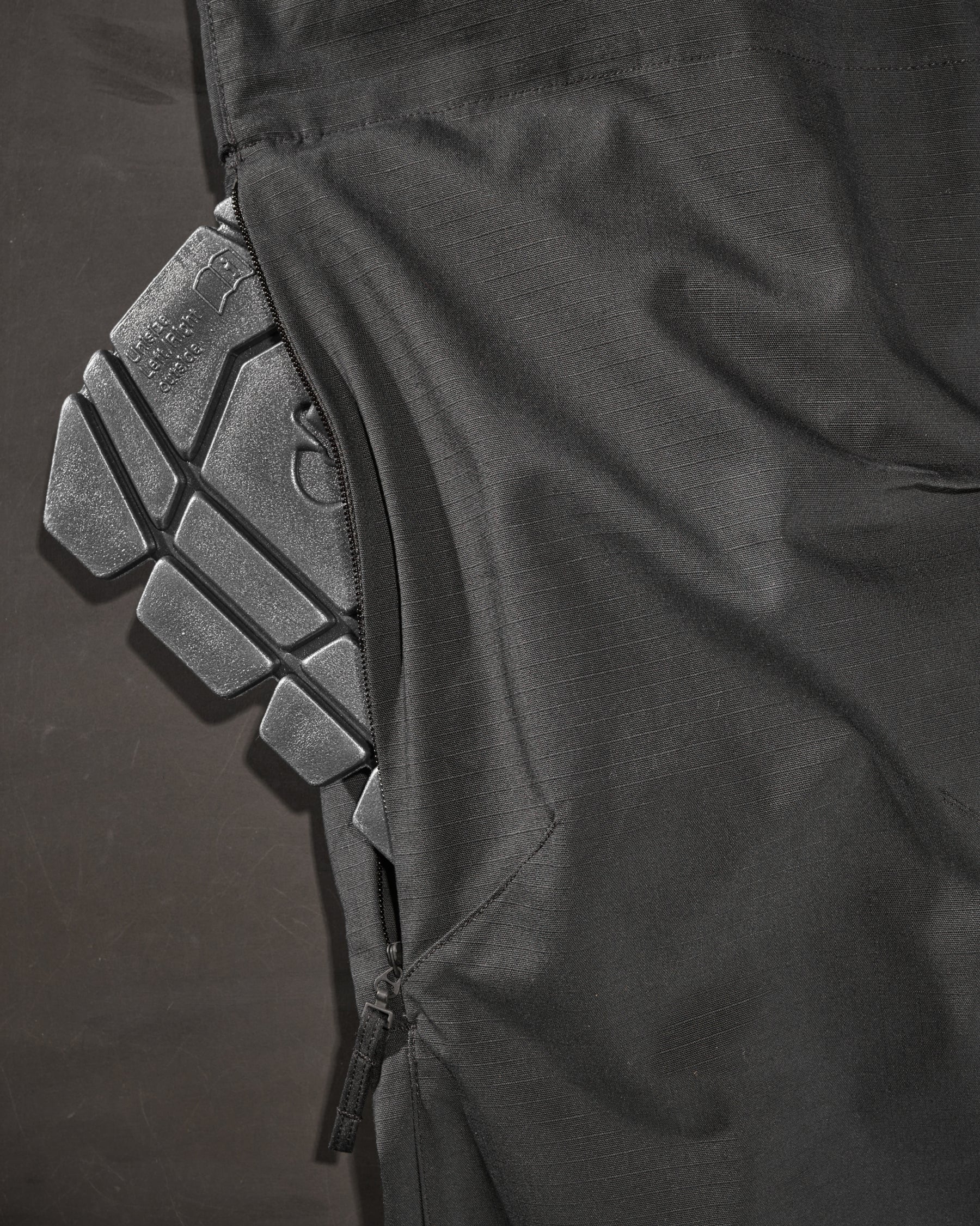 Close-up of knee pad pocket details on Women's Ripstop Cargo Work Pants e.s.e:pic in black