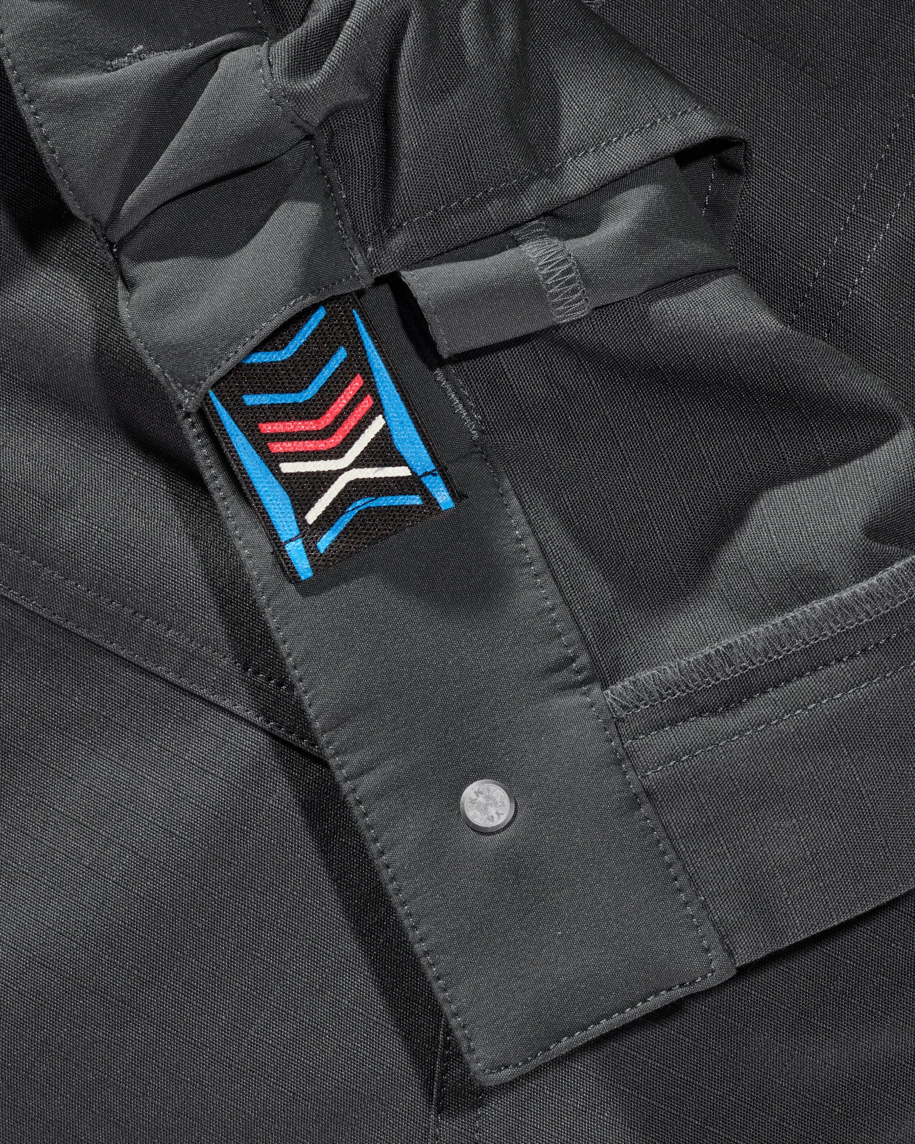 Close-up of reinforced fabric and seams on Women's Ripstop Cargo Work Pants e.s.e:pic in carbon gray
