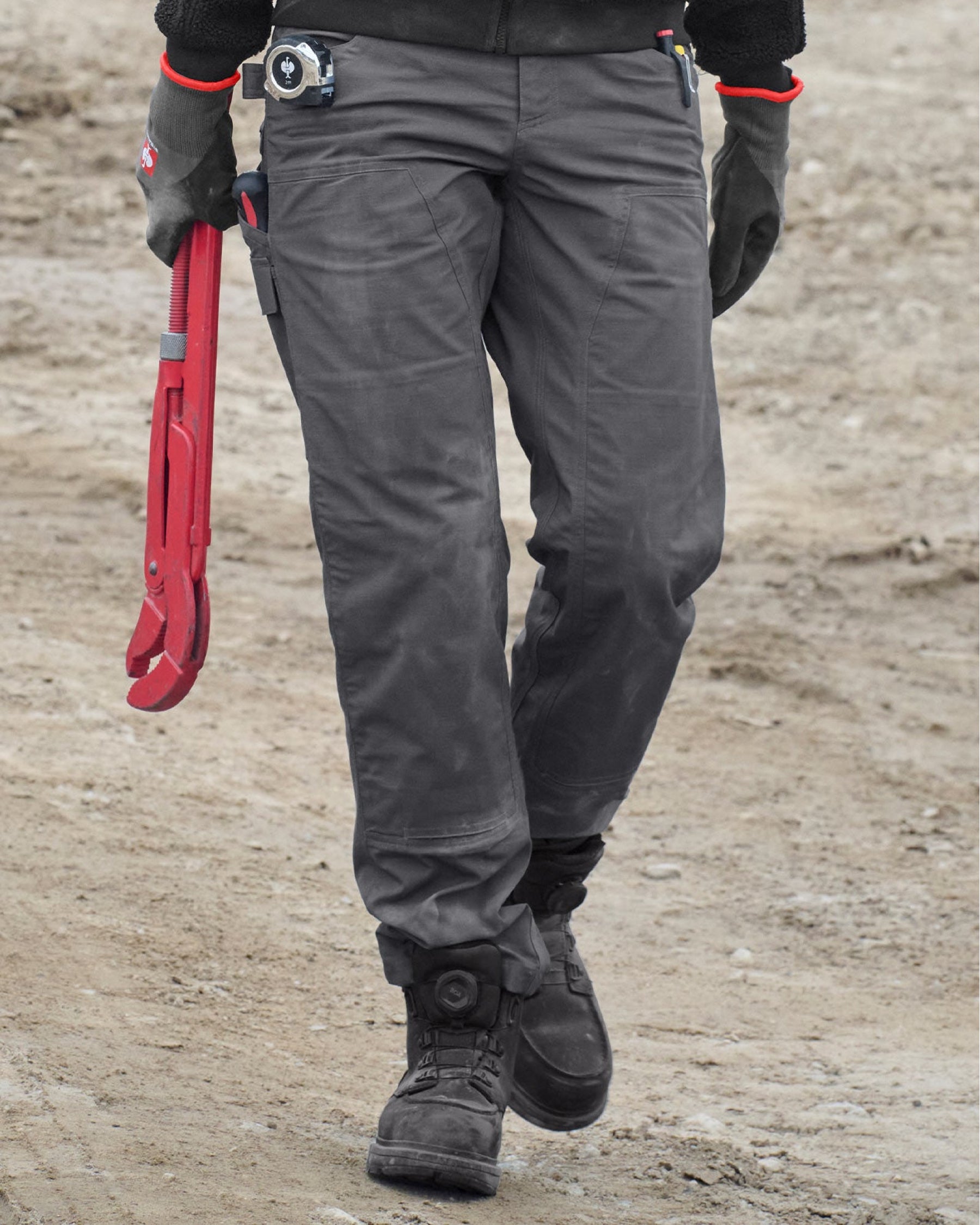 Lifestyle view of Women's Double Front Ripstop Cargo Work Pants e.s.e:pic in carbon gray during work