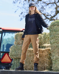 Women's Double Front Ripstop Cargo Work Pants e.s.e:pic in almond brown in use, showing fit and movement