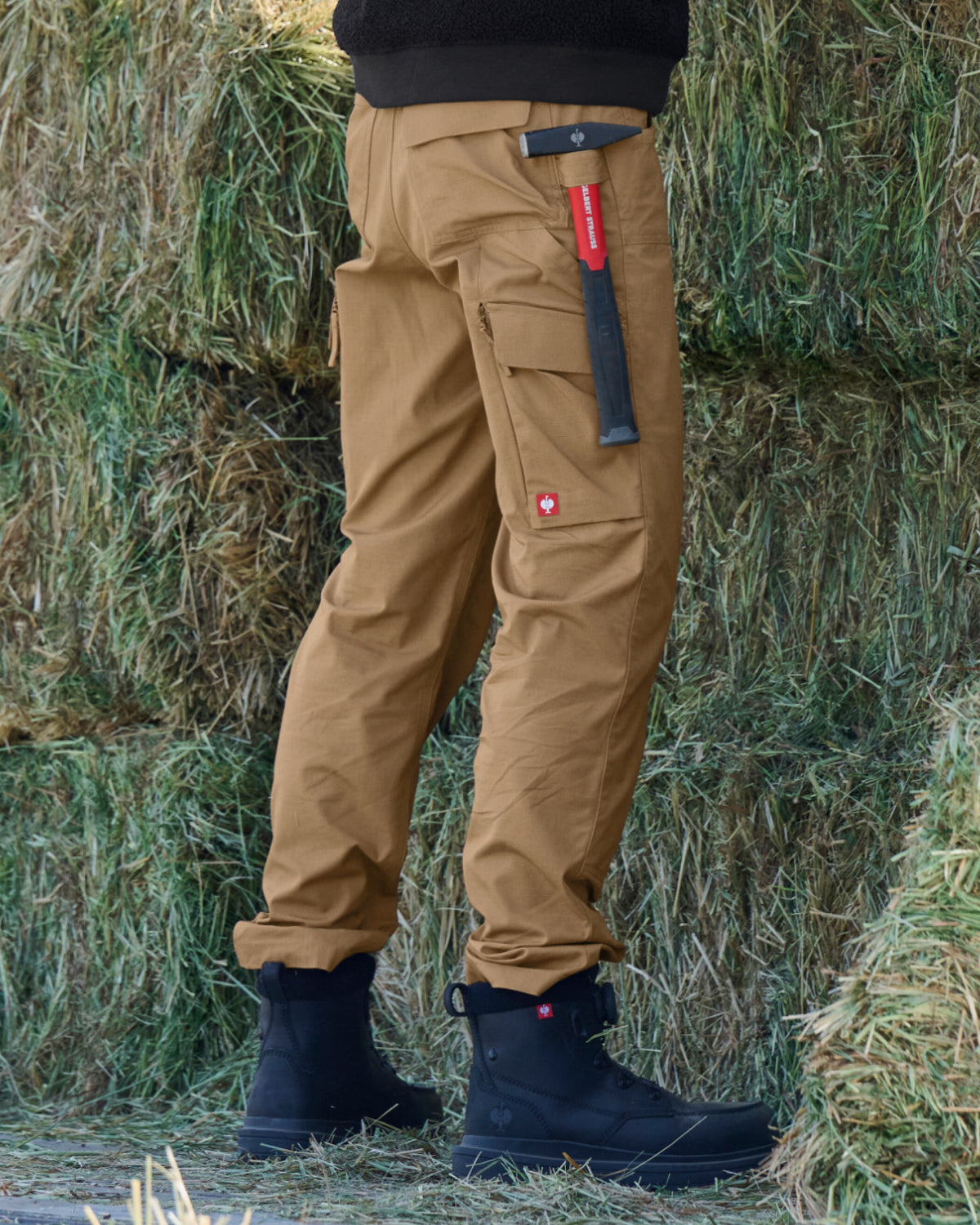 Lifestyle view of Women's Double Front Ripstop Cargo Work Pants e.s.e:pic in almond brown during work