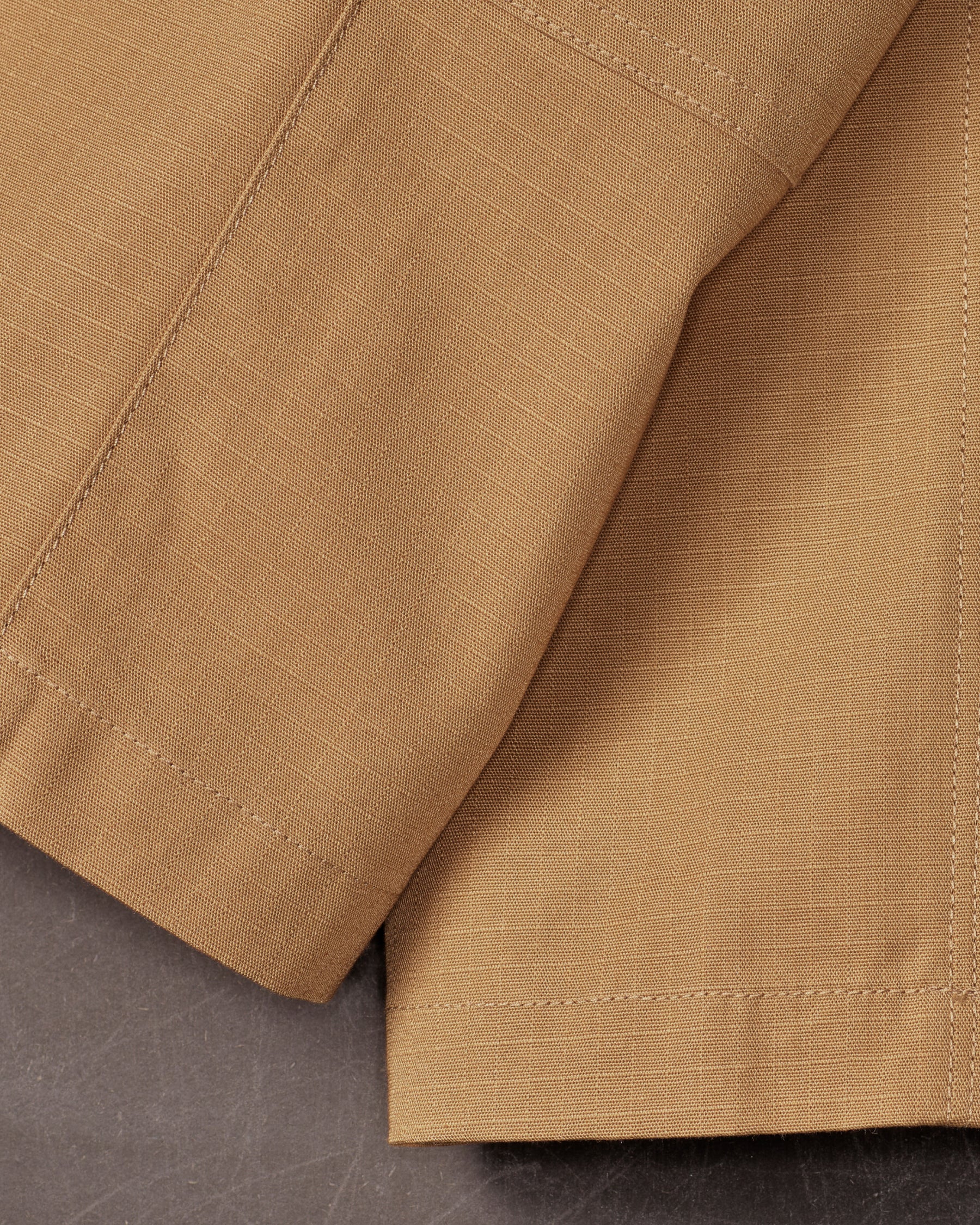Close-up of reinforced fabric and seams on Kids' Double Front Ripstop Cargo Pants e.s.e:pic in almond brown