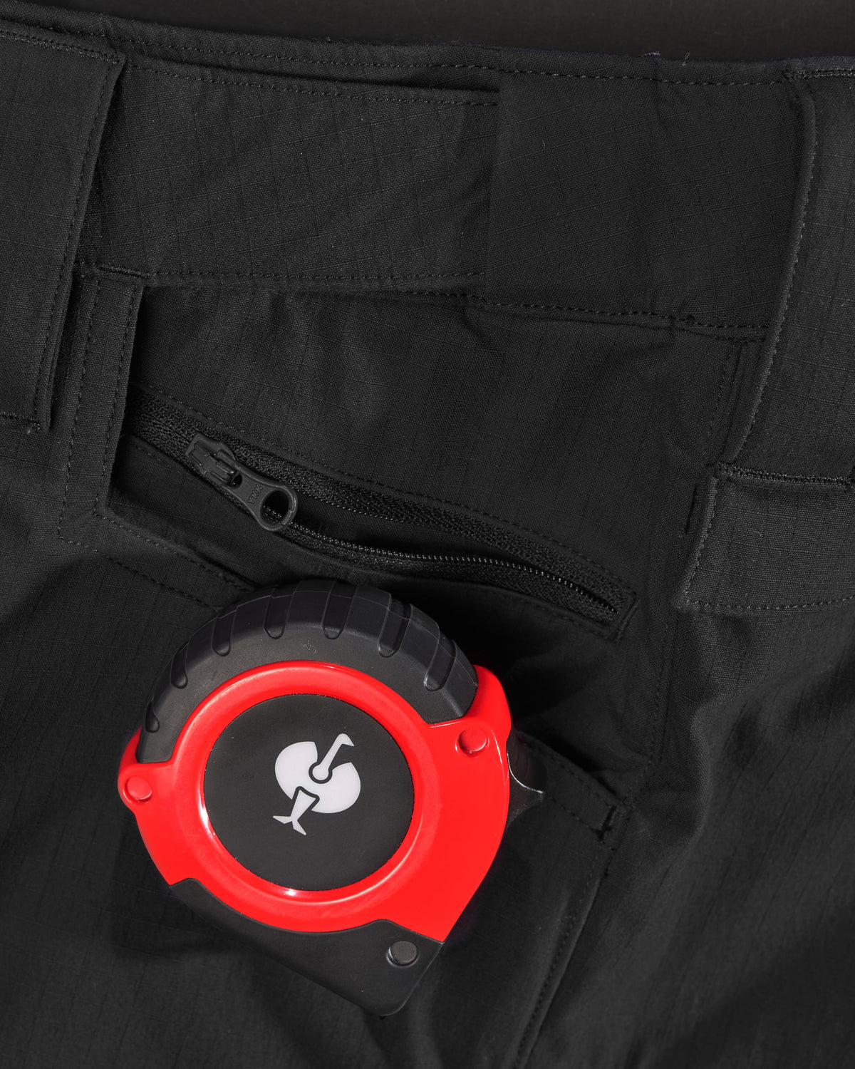 Close-up of reinforced fabric and seams on Stretch Ripstop Cargo Work Pants e.s.taktik in black