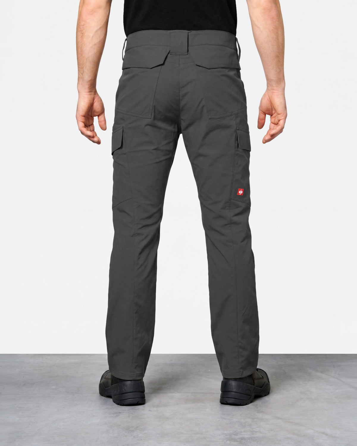 Stretch Ripstop Cargo Work Pants e.s.taktik in carbon gray worn by a model, rear view