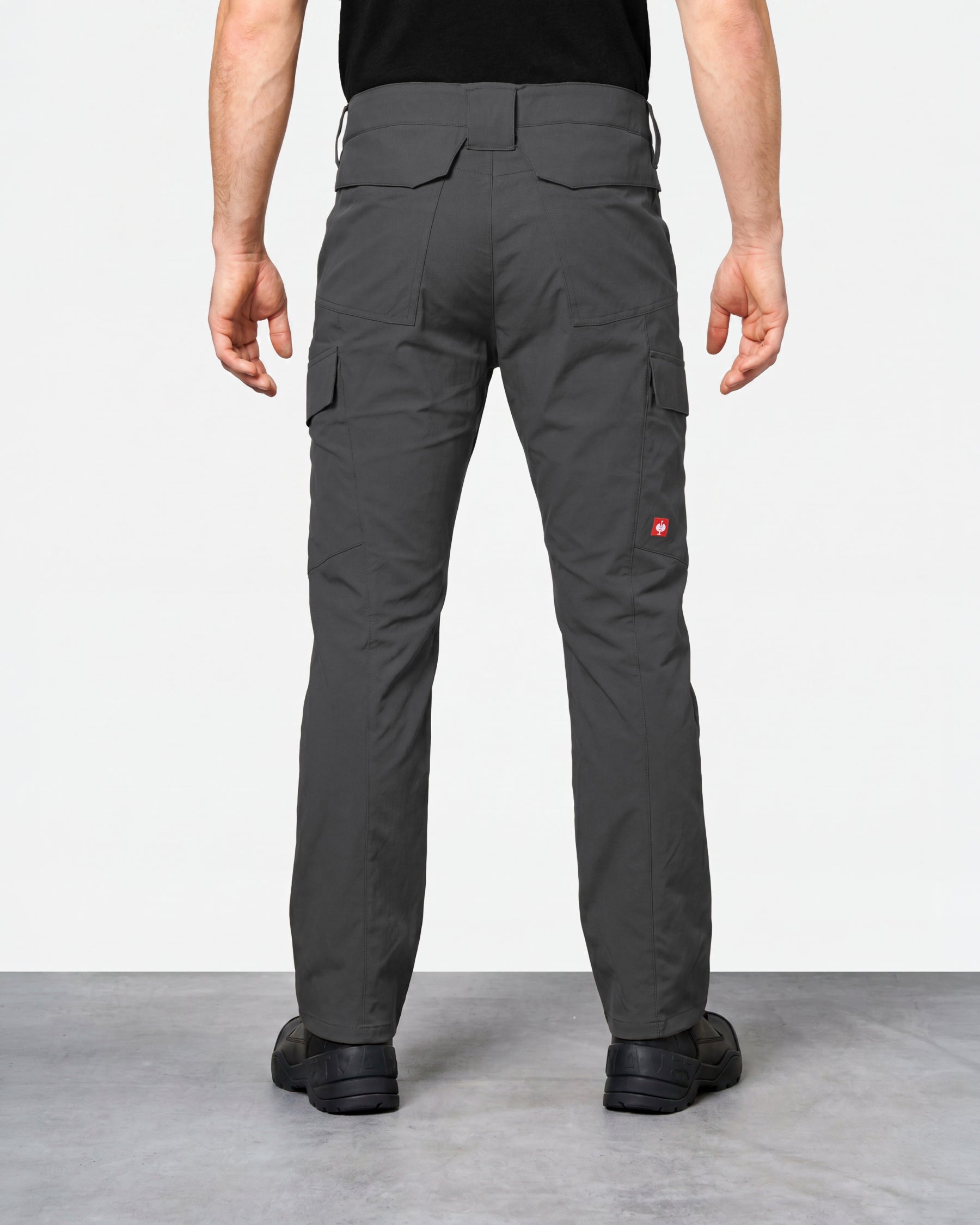 Stretch Ripstop Cargo Work Pants e.s.taktik in carbon gray worn by a model, rear view