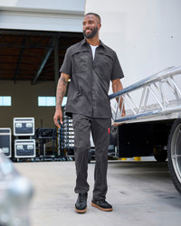 Stretch Ripstop Cargo Work Pants e.s.taktik in carbon gray shown in an outdoor workwear setting