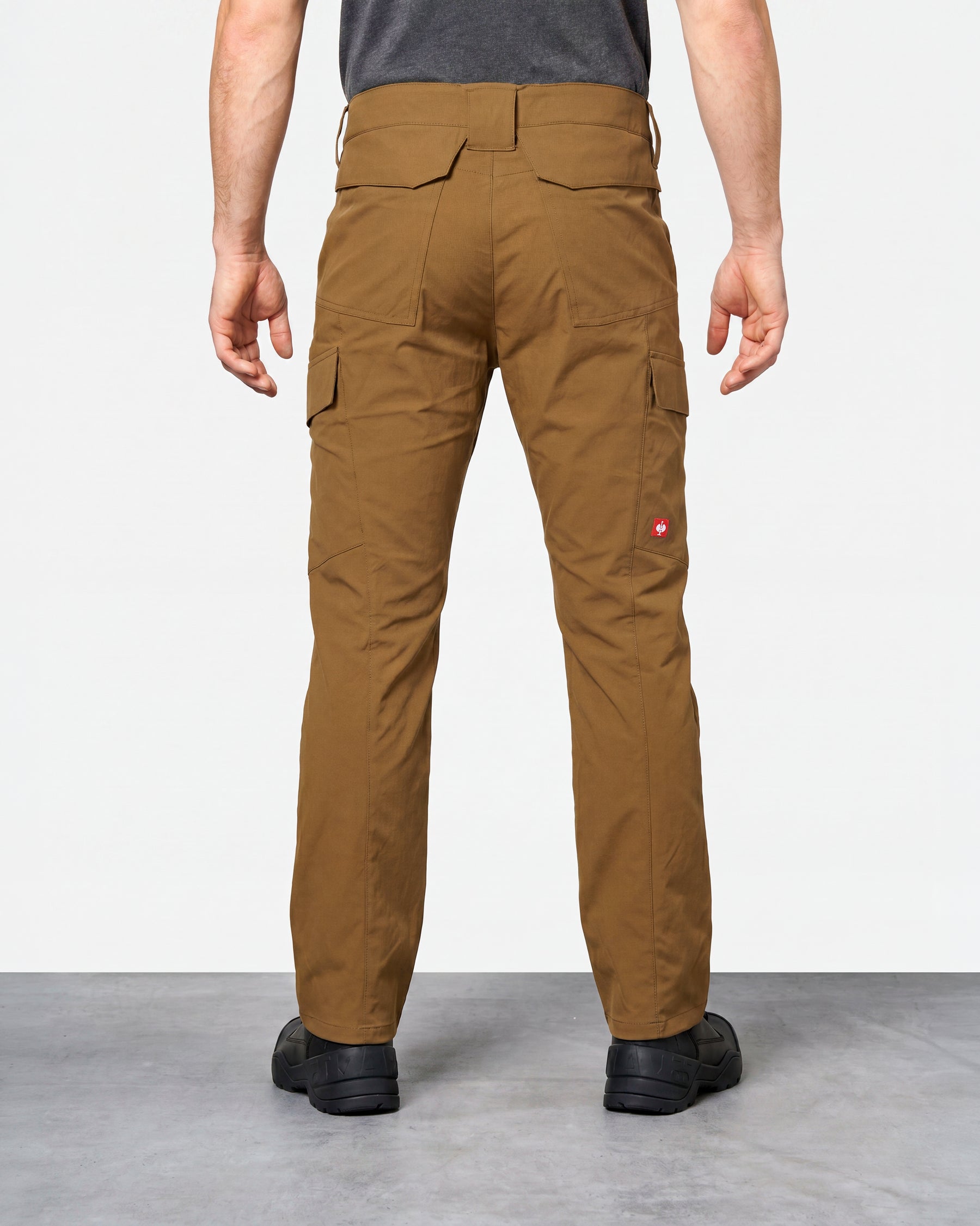 Stretch Ripstop Cargo Work Pants e.s.taktik in desert brown worn by a model, rear view