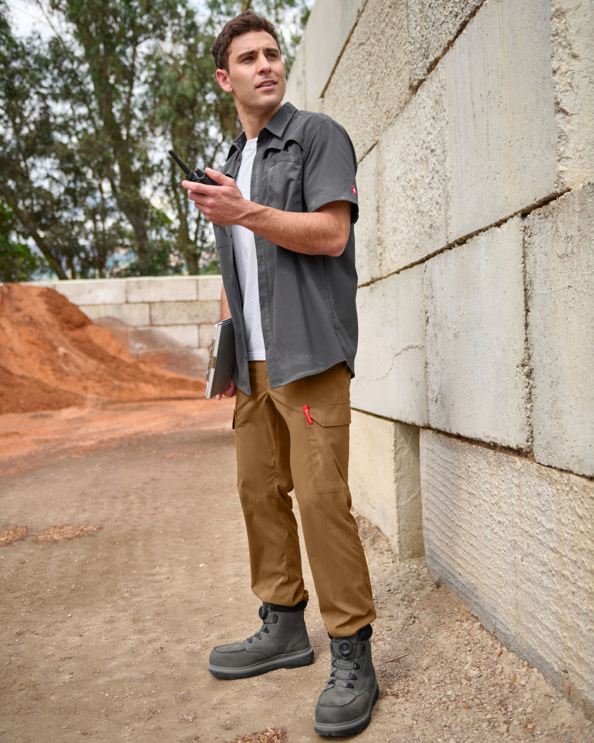 Stretch Ripstop Cargo Work Pants e.s.taktik in desert brown shown in an outdoor workwear setting