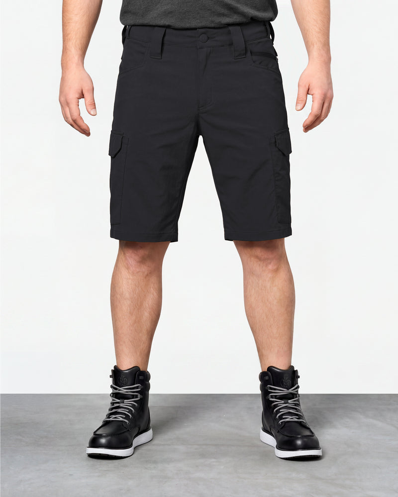 Model wearing Engelbert Strauss e.s. taktik stretch ripstop cargo work shorts in black, showing the fit, length, waistband, and front pocket layout of the durable stretch ripstop cargo work shorts with utility pockets.