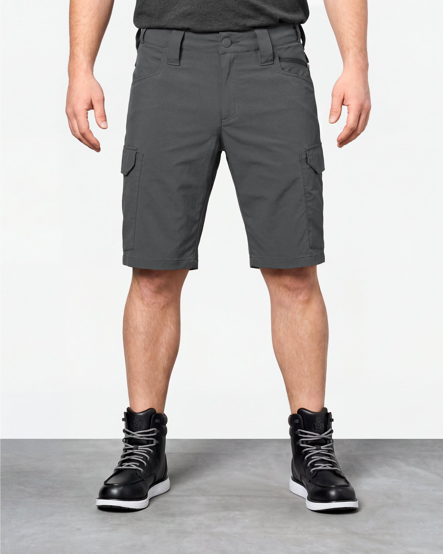 Model wearing Engelbert Strauss e.s. taktik stretch ripstop cargo work shorts in carbon gray, showing the fit, length, waistband, and front pocket layout of the durable stretch ripstop cargo work shorts with utility pockets.