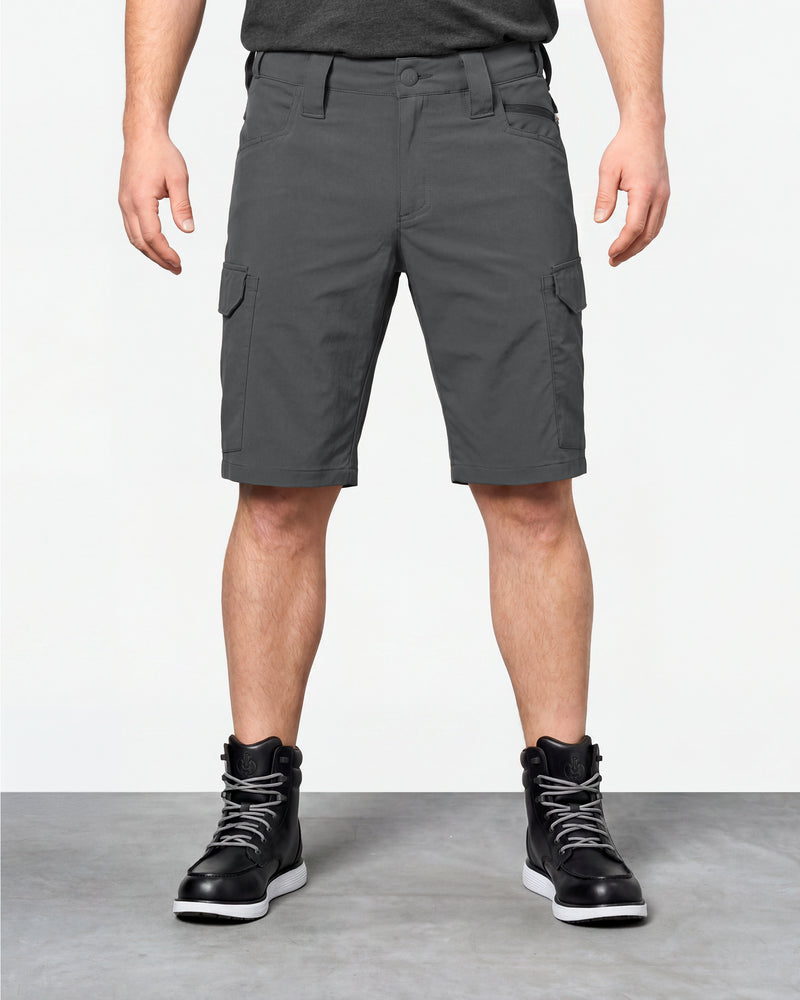 Model wearing Engelbert Strauss e.s. taktik stretch ripstop cargo work shorts in carbon gray, showing the fit, length, waistband, and front pocket layout of the durable stretch ripstop cargo work shorts with utility pockets.