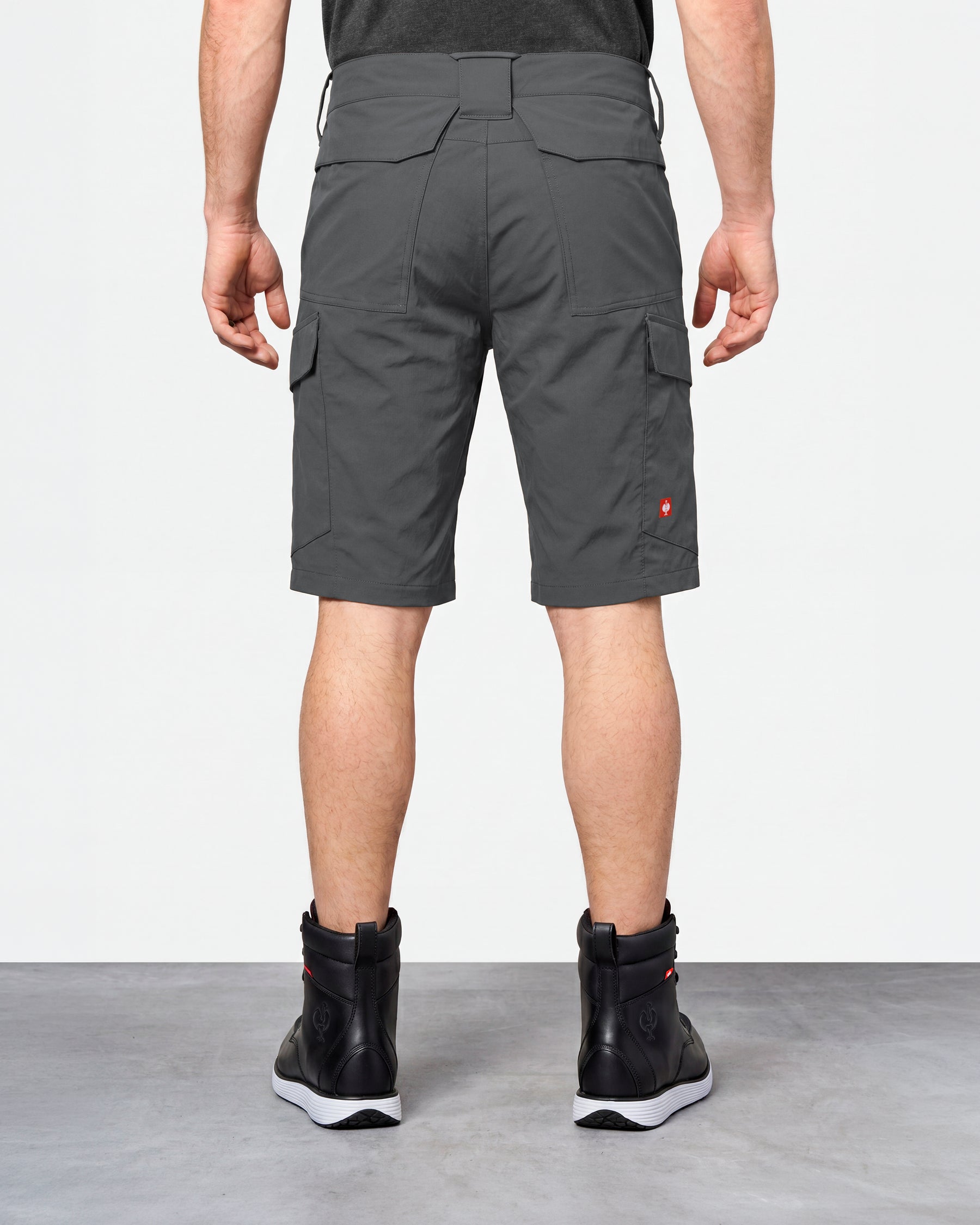 Alternate model view of Engelbert Strauss e.s. taktik stretch ripstop cargo work shorts in carbon gray, showing the side and back fit with visible utility pocket placement and workwear construction.