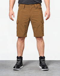 Model wearing Engelbert Strauss e.s. taktik stretch ripstop cargo work shorts in desert brown, showing the fit, length, waistband, and front pocket layout of the durable stretch ripstop cargo work shorts with utility pockets.