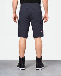 Alternate model view of Engelbert Strauss e.s. taktik stretch ripstop cargo work shorts in nero blue, showing the side and back fit with visible utility pocket placement and workwear construction.
