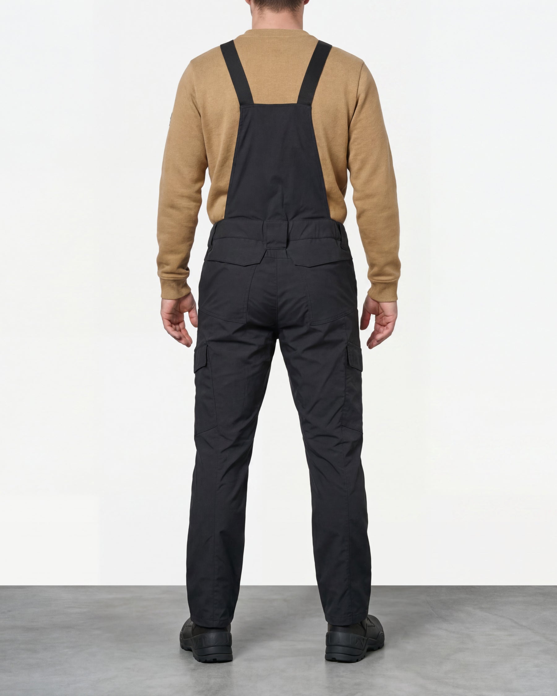 black STRAUSS Stretch Ripstop Cargo Work Bib Overall e.s.taktik worn by a model, back view