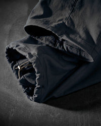 Close-up of black STRAUSS Stretch Ripstop Cargo Work Bib Overall e.s.taktik cargo pocket and ripstop fabric details
