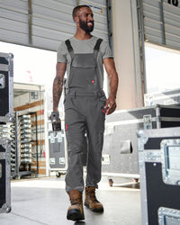 carbon gray STRAUSS Stretch Ripstop Cargo Work Bib Overall e.s.taktik worn in a work setting