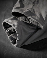 Close-up of carbon gray STRAUSS Stretch Ripstop Cargo Work Bib Overall e.s.taktik cargo pocket and ripstop fabric details