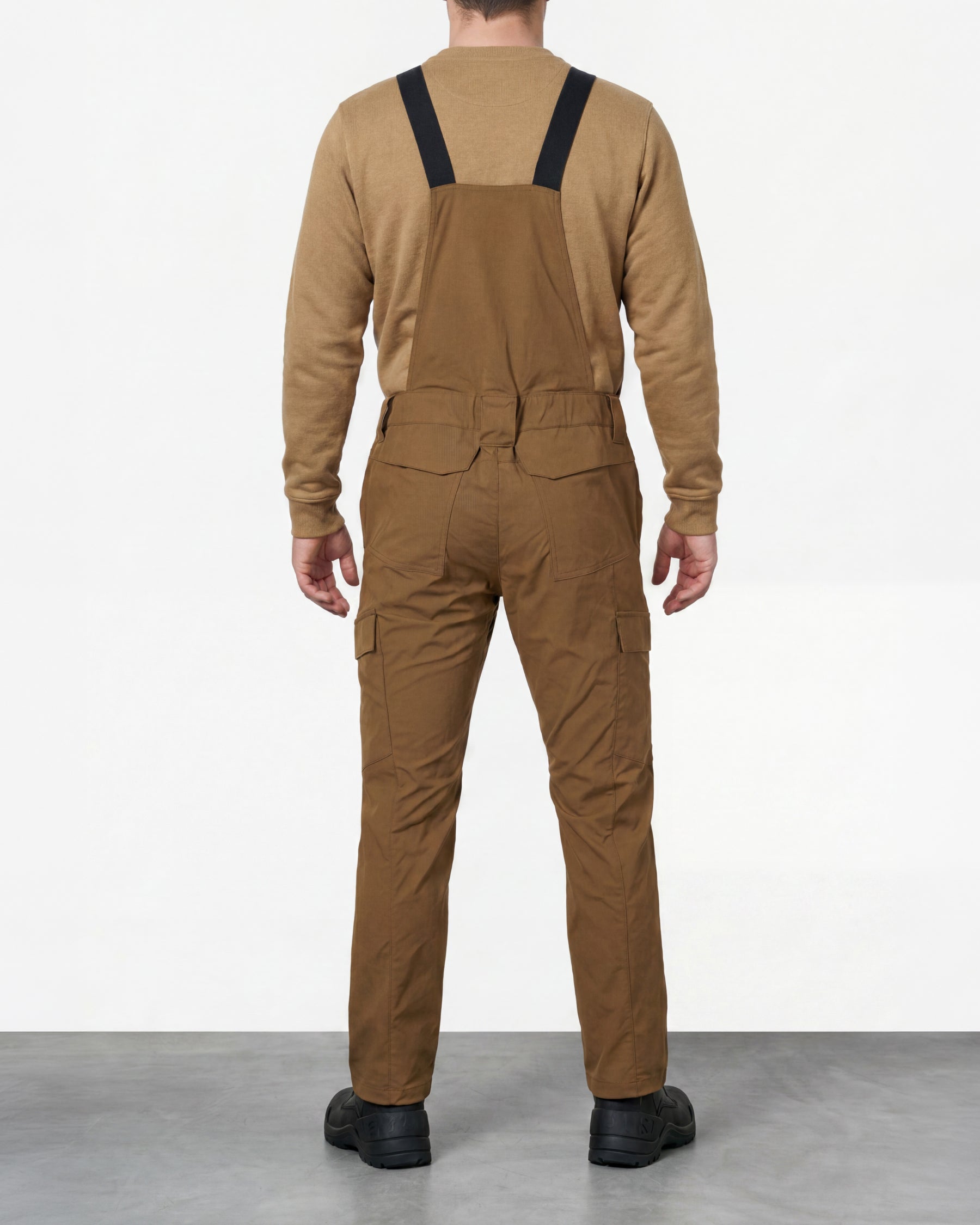 desert brown STRAUSS Stretch Ripstop Cargo Work Bib Overall e.s.taktik worn by a model, back view