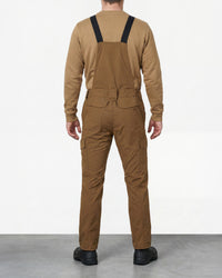 desert brown STRAUSS Stretch Ripstop Cargo Work Bib Overall e.s.taktik worn by a model, back view