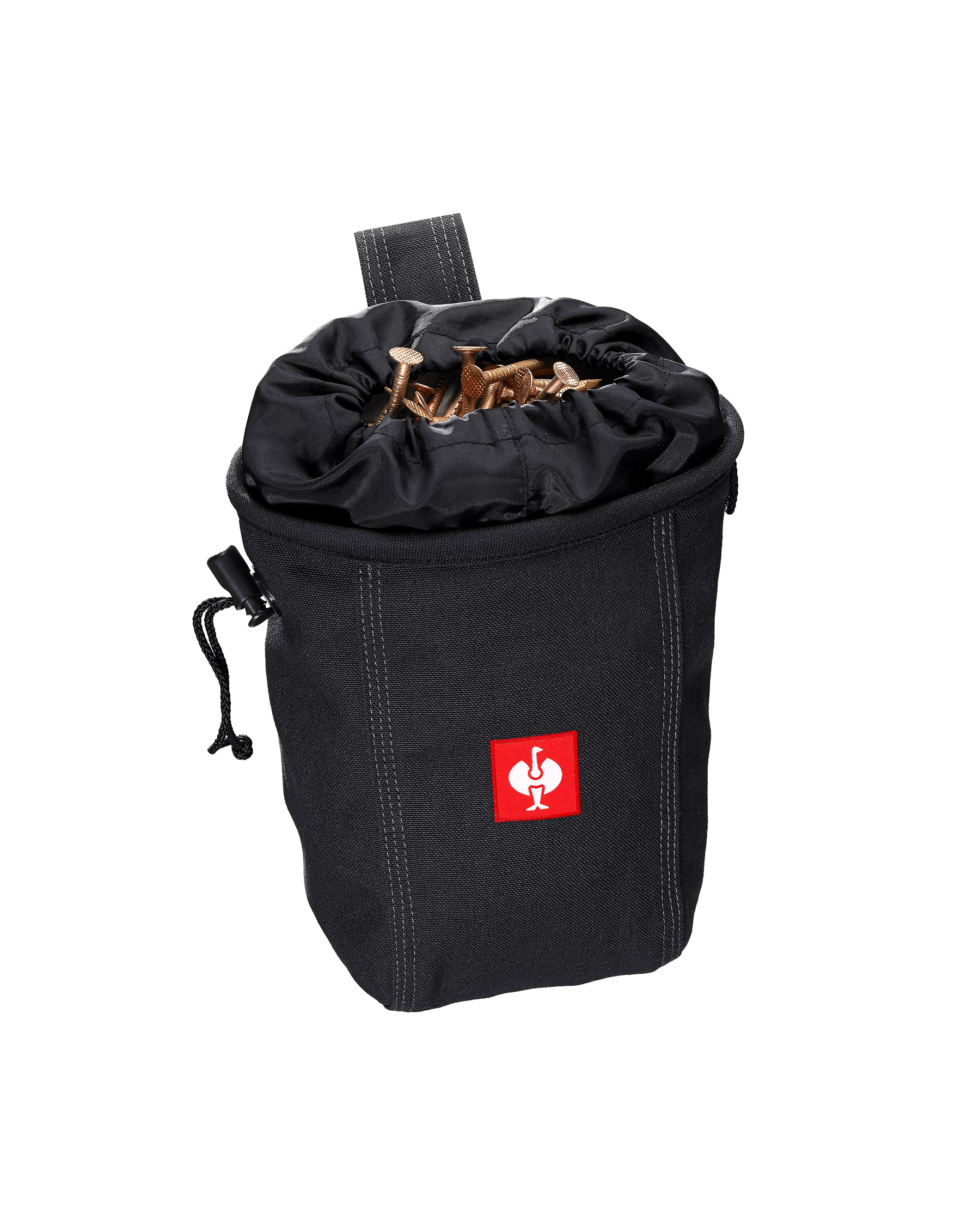 A worker wears a black STRAUSS nail bag on a belt with work pants while handling fasteners.