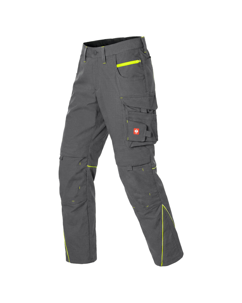 Dark gray work pants with multiple cargo pockets and high-waisted design, featuring bright neon yellow-green contrast stitching and a small red Swiss flag patch on the side pocket.