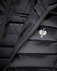 Close-up of quilted vest panels and zipper details on STRAUSS e.s.motion ten vest in oxid black