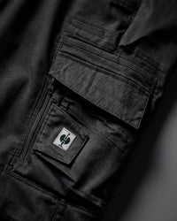 Close-up of cargo pocket details on Women's Cargo Work Pants e.s.motion ten in oxid black