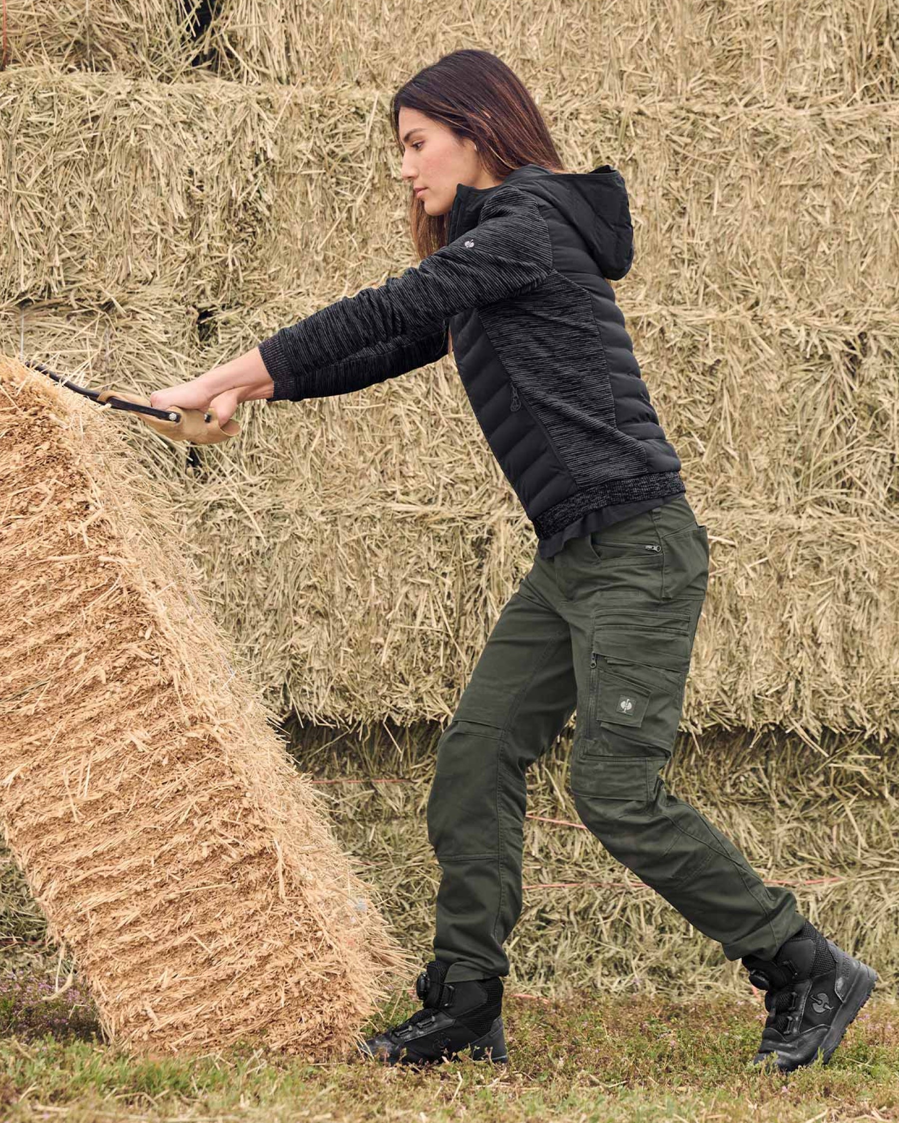 STRAUSS women's e.s.motion ten hybrid hooded jacket in oxid black melange in use on the job