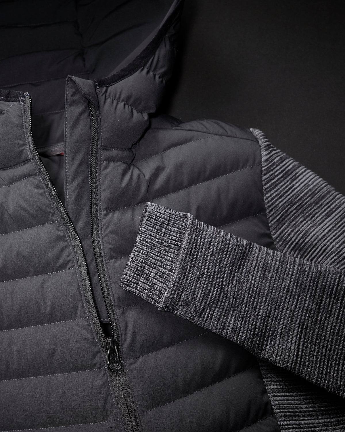 Close-up of quilted and stretch panel details on STRAUSS women's e.s.motion ten hybrid hooded jacket in oxid black melange
