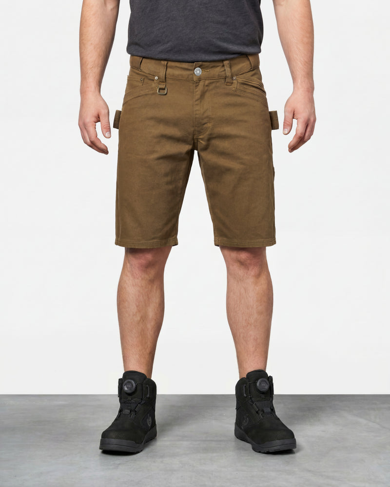 Model wearing Engelbert Strauss e.s. vintage multipocket shorts in sepia, showing the fit, length, waistband, and front pocket layout of the rugged multipocket work shorts with a vintage workwear look.