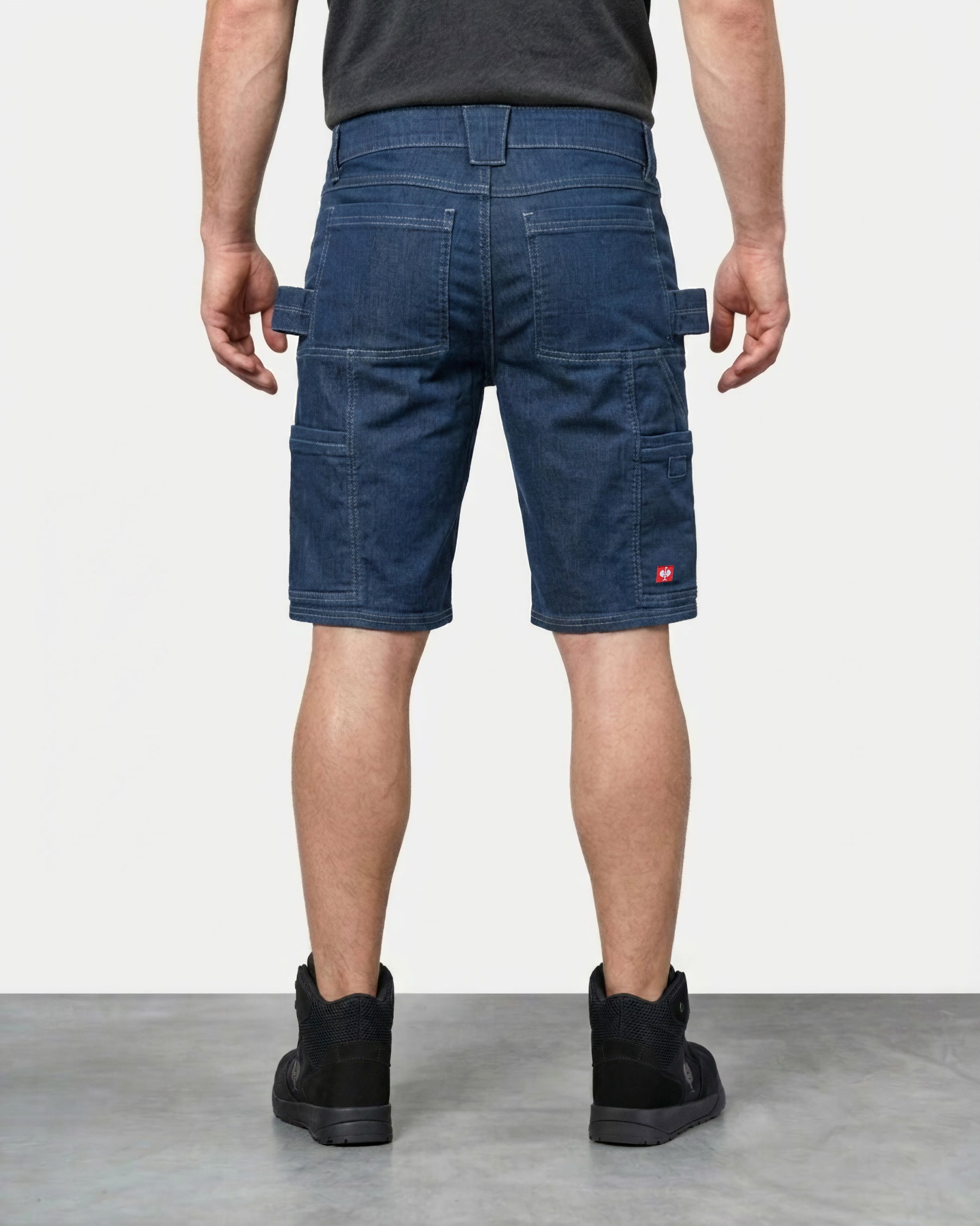 Alternate model view of Engelbert Strauss e.s. vintage multipocket shorts in arctic blue, showing the side and back fit with visible utility pocket placement and workwear construction.