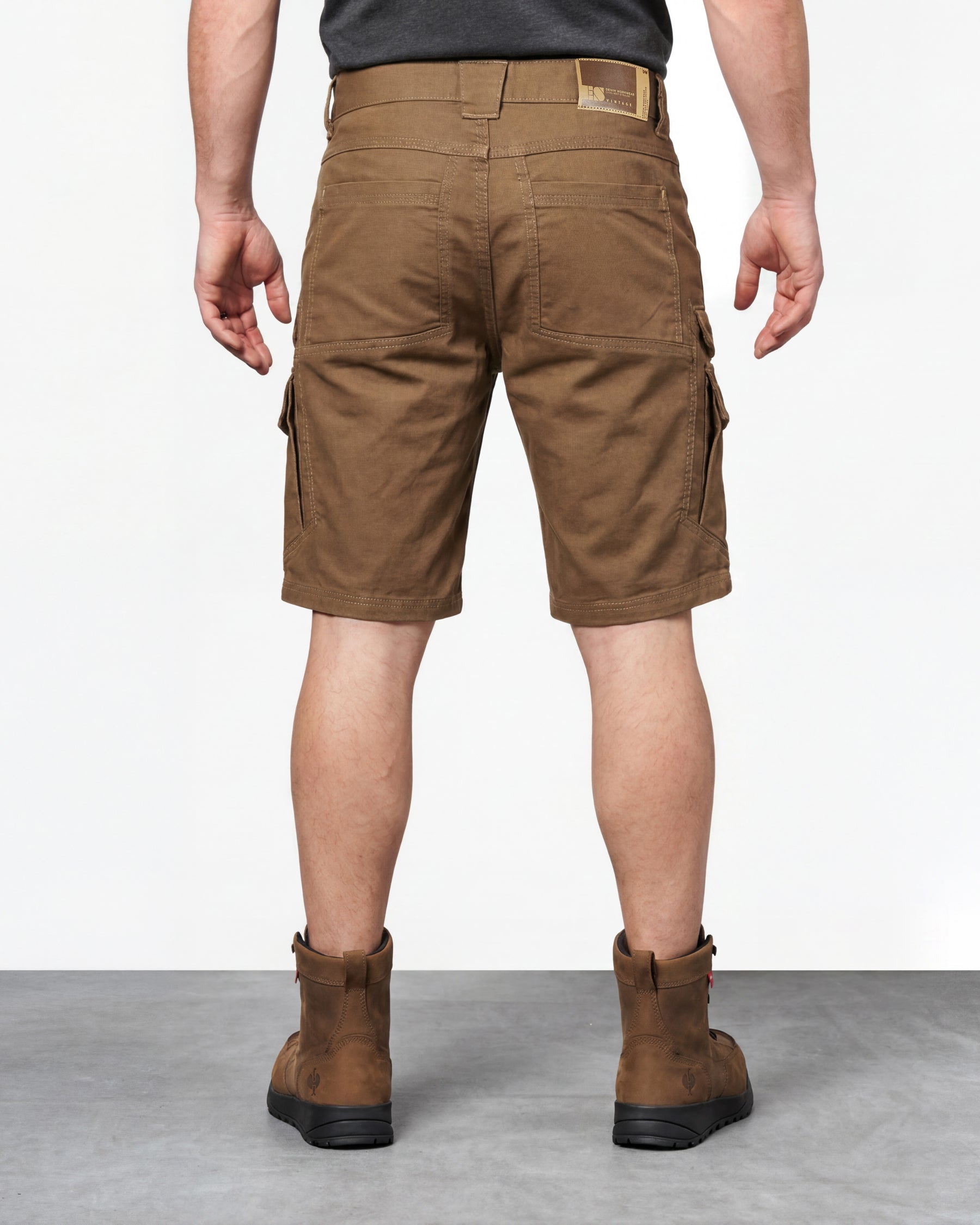 Alternate model view of Engelbert Strauss e.s. vintage cargo shorts in sepia, showing the side and back fit with visible utility pocket placement and workwear construction.
