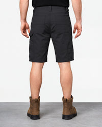 Alternate model view of Engelbert Strauss e.s. iconic shorts in black, showing the side and back fit with visible utility pocket placement and workwear construction.