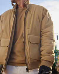 STRAUSS e.s.iconic bomber jacket in almond brown worn in a work setting