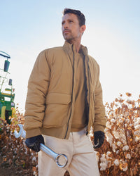 STRAUSS e.s.iconic bomber jacket in almond brown shown during outdoor work