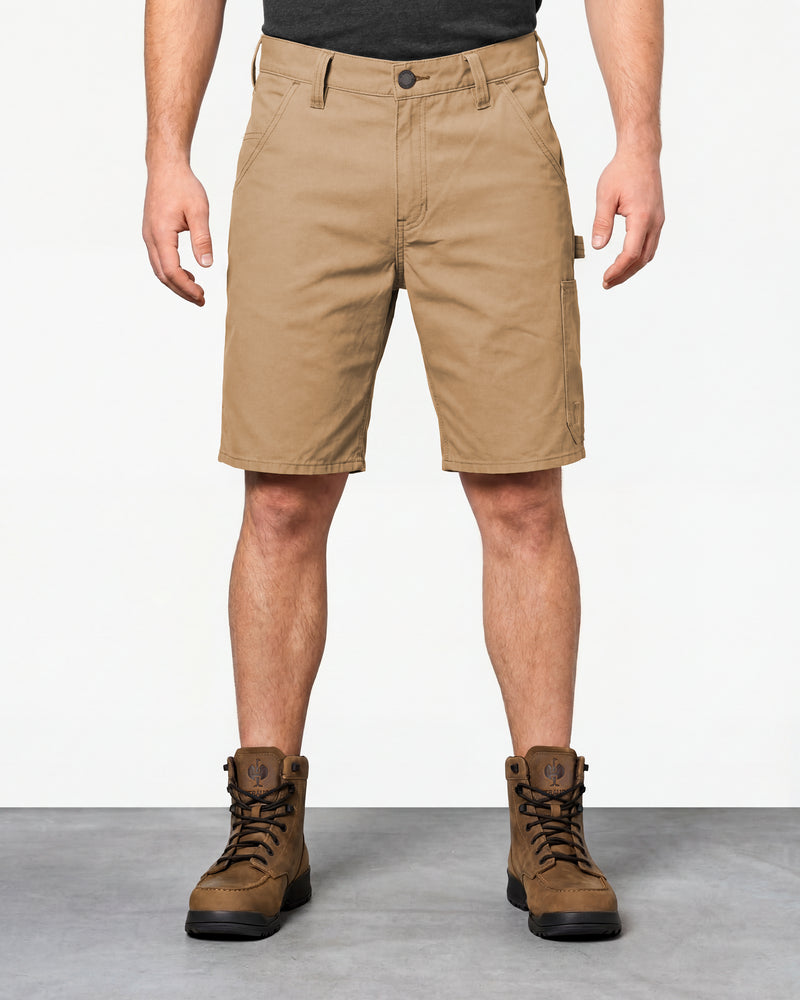 Model wearing Engelbert Strauss e.s. iconic shorts in almond brown, showing the fit, length, waistband, and front pocket layout of the classic work shorts with functional pocket details.