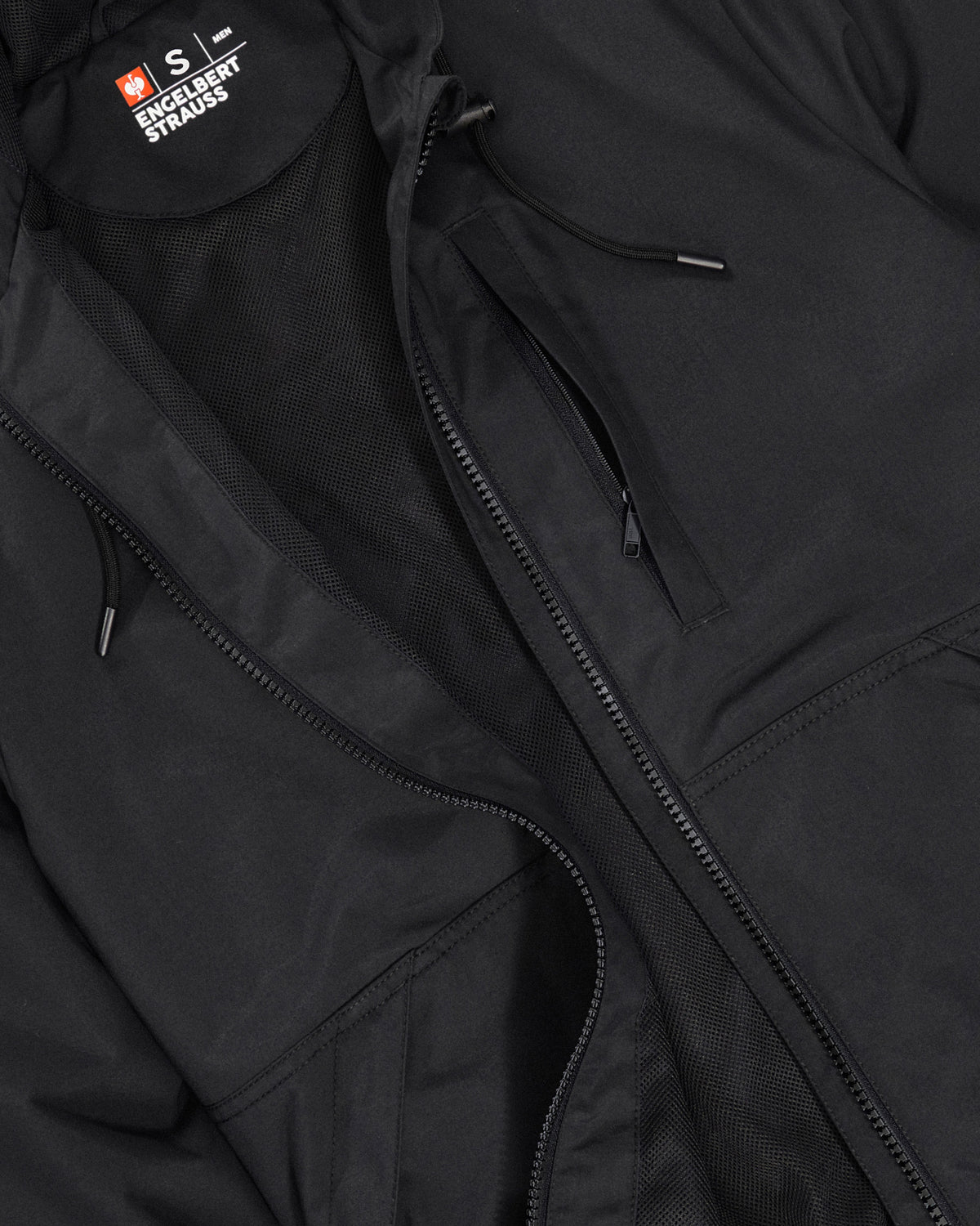 Close-up of lightweight shell and zipper details on STRAUSS e.s.iconic lightweight jacket in black