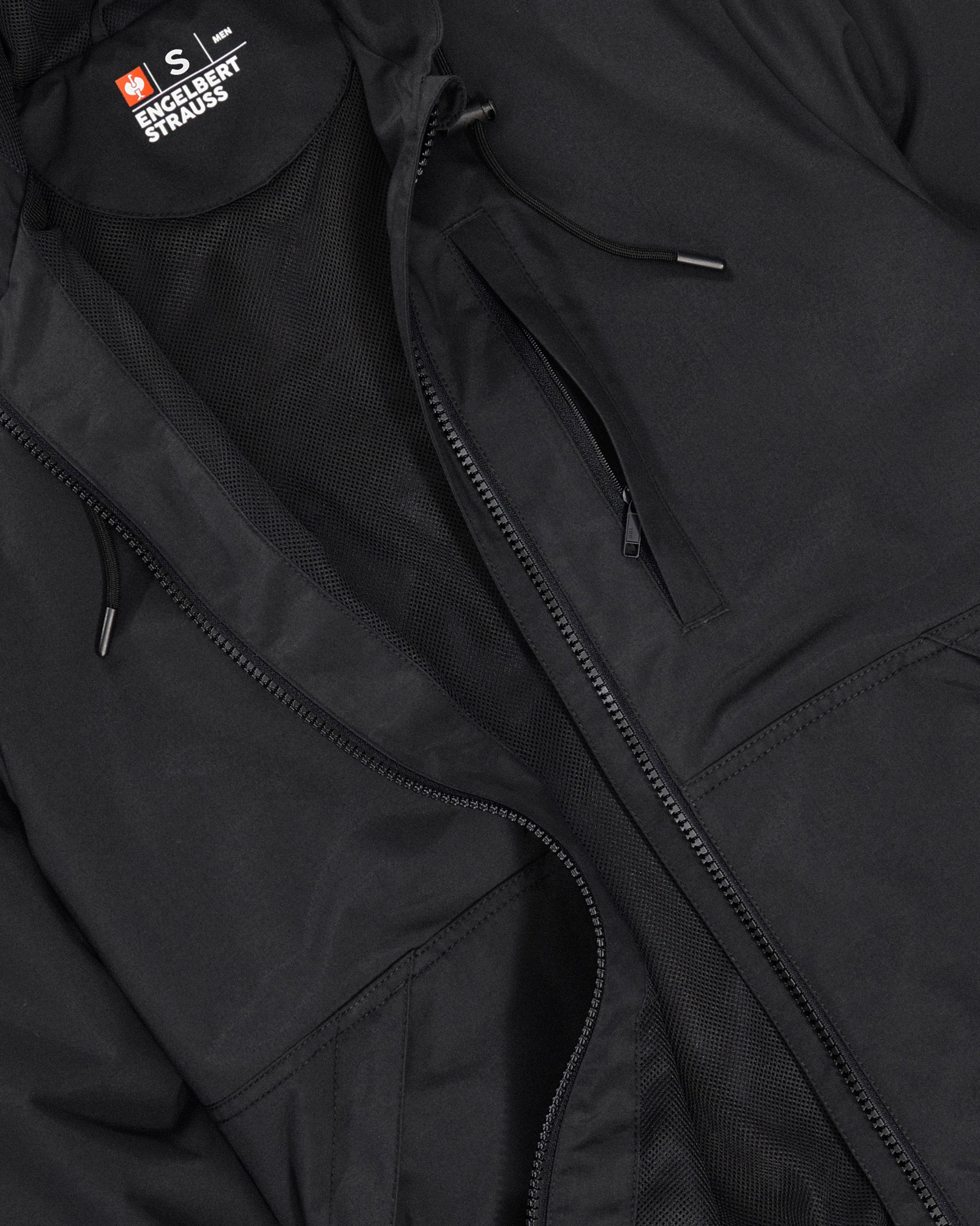 Close-up of lightweight shell and zipper details on STRAUSS e.s.iconic lightweight jacket in black