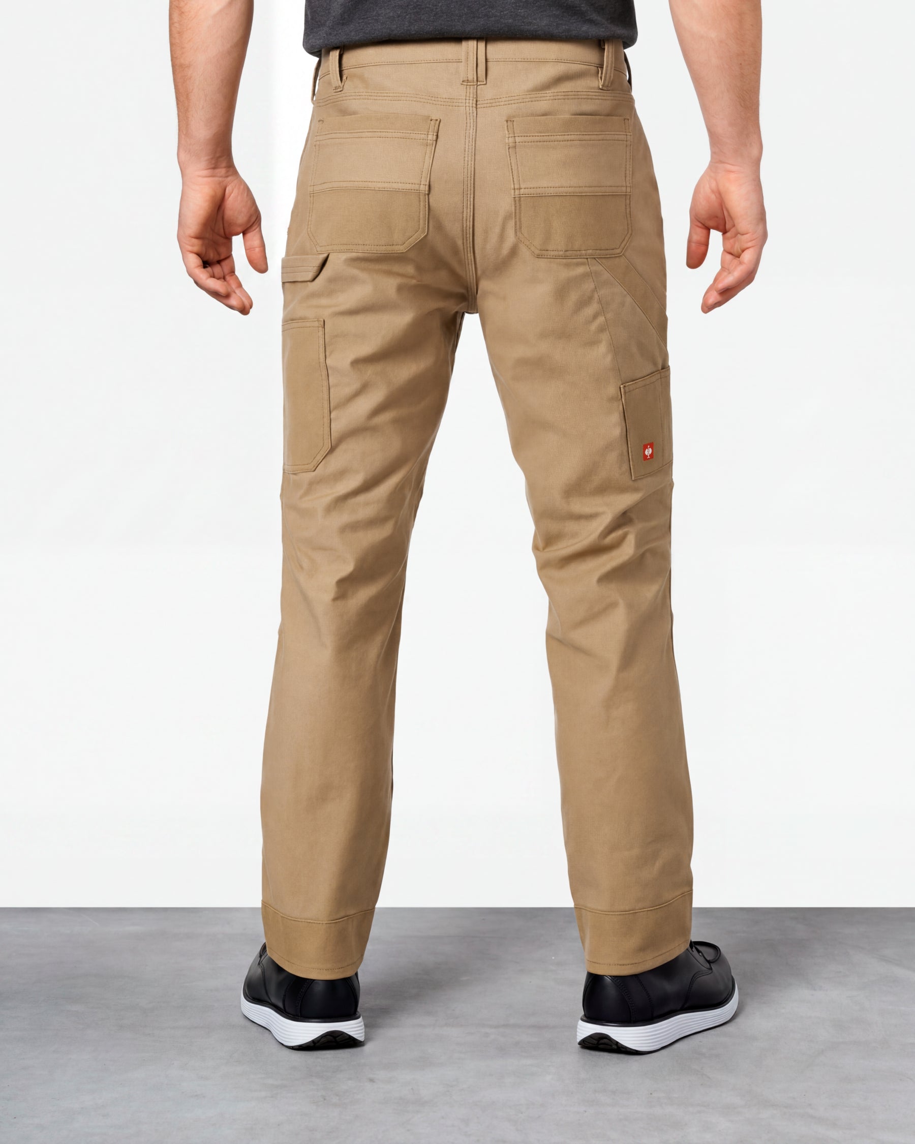 Double Front Work Pants e.s.iconic in almond brown worn by a model, rear view