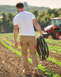 Lifestyle view of Double Front Work Pants e.s.iconic in almond brown during work