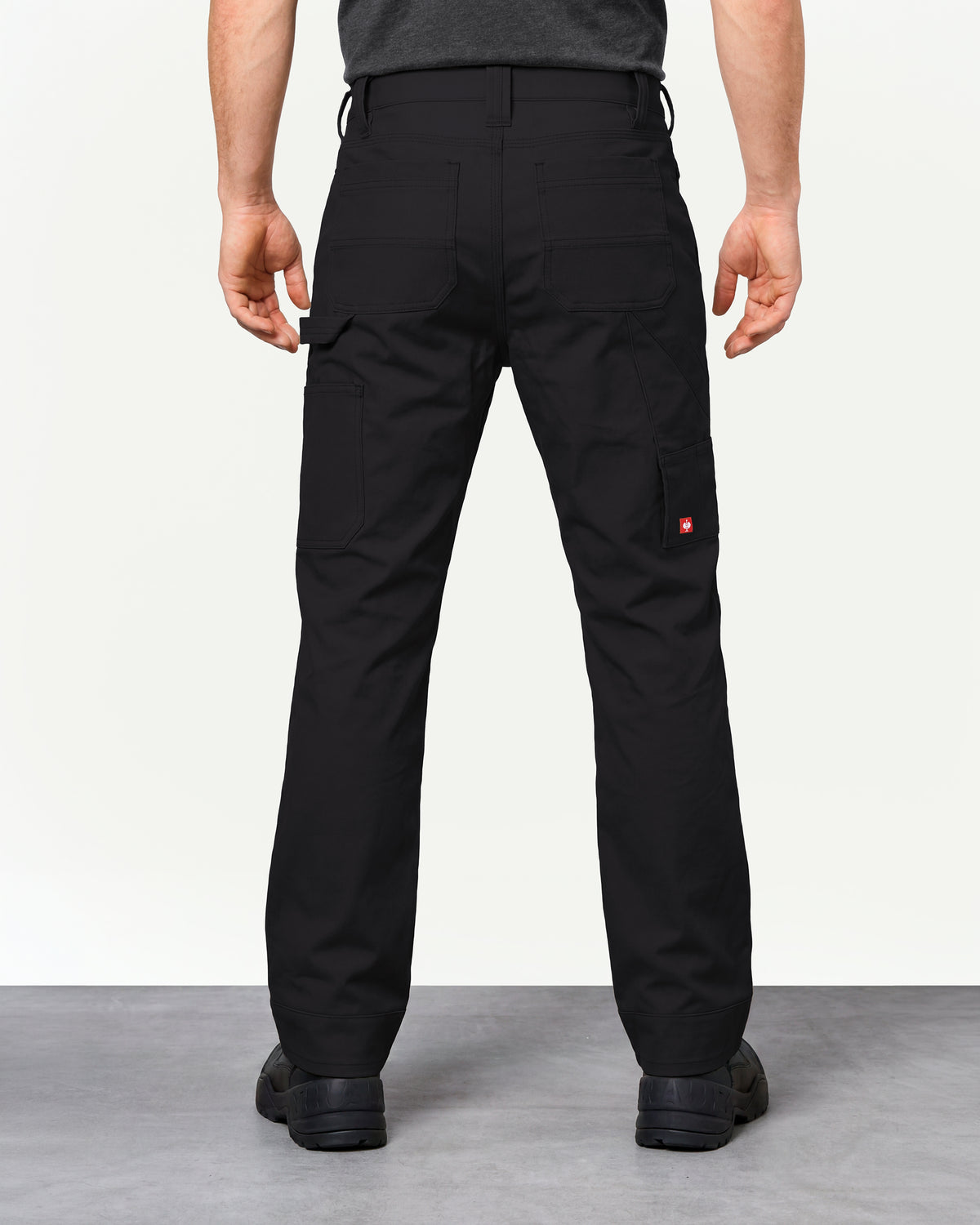 Pocket Protected Work Pants e.s.iconic in black worn by a model, rear view