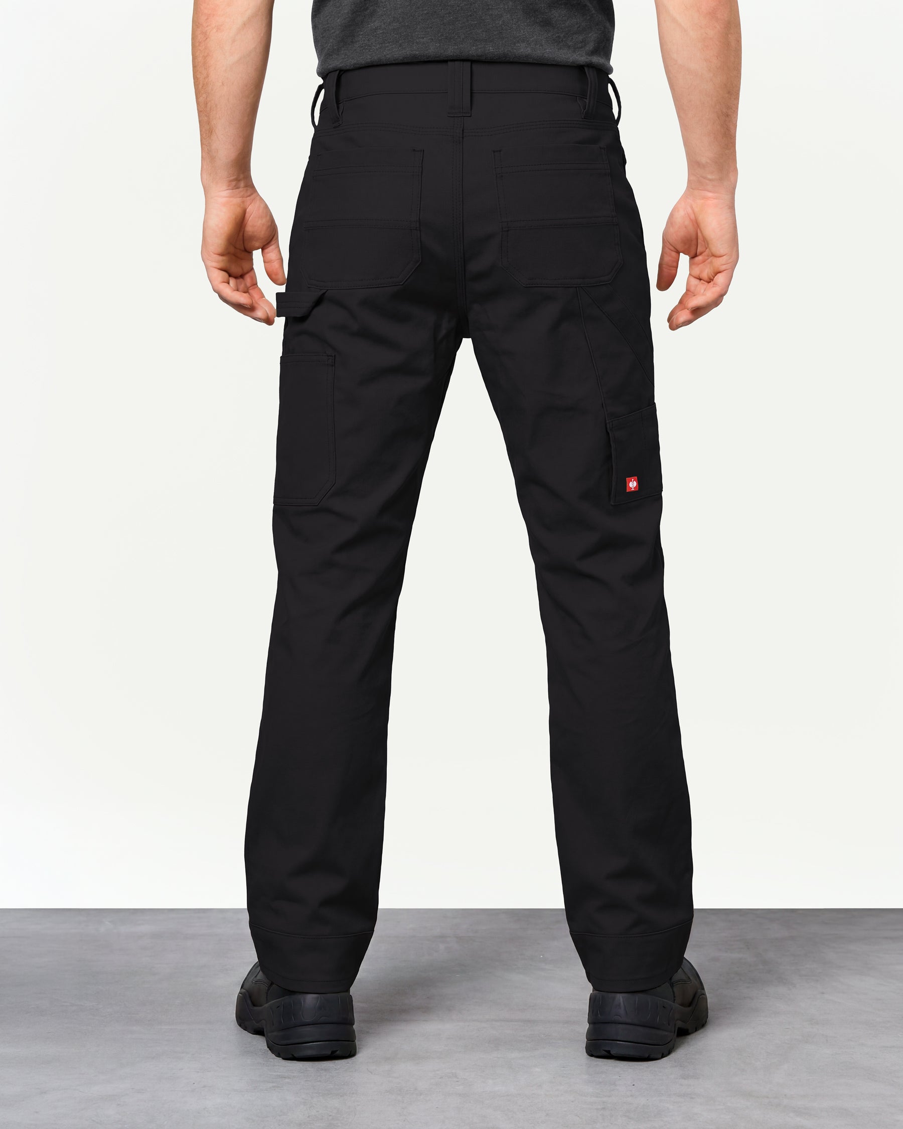 Pocket Protected Work Pants e.s.iconic in black worn by a model, rear view