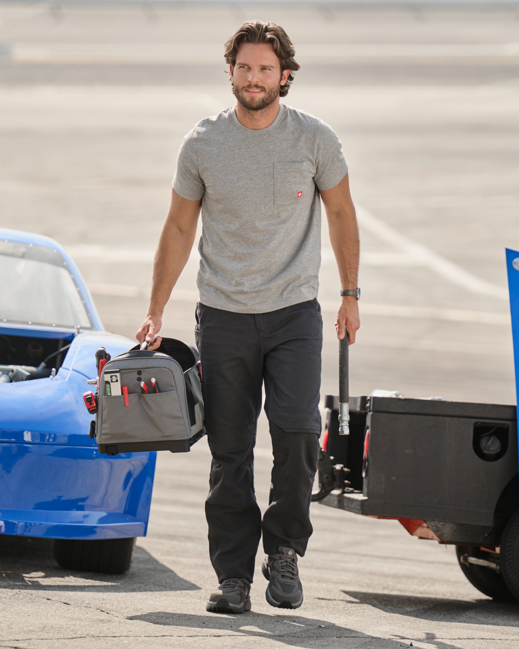Lifestyle view of Pocket Protected Work Pants e.s.iconic in black during work