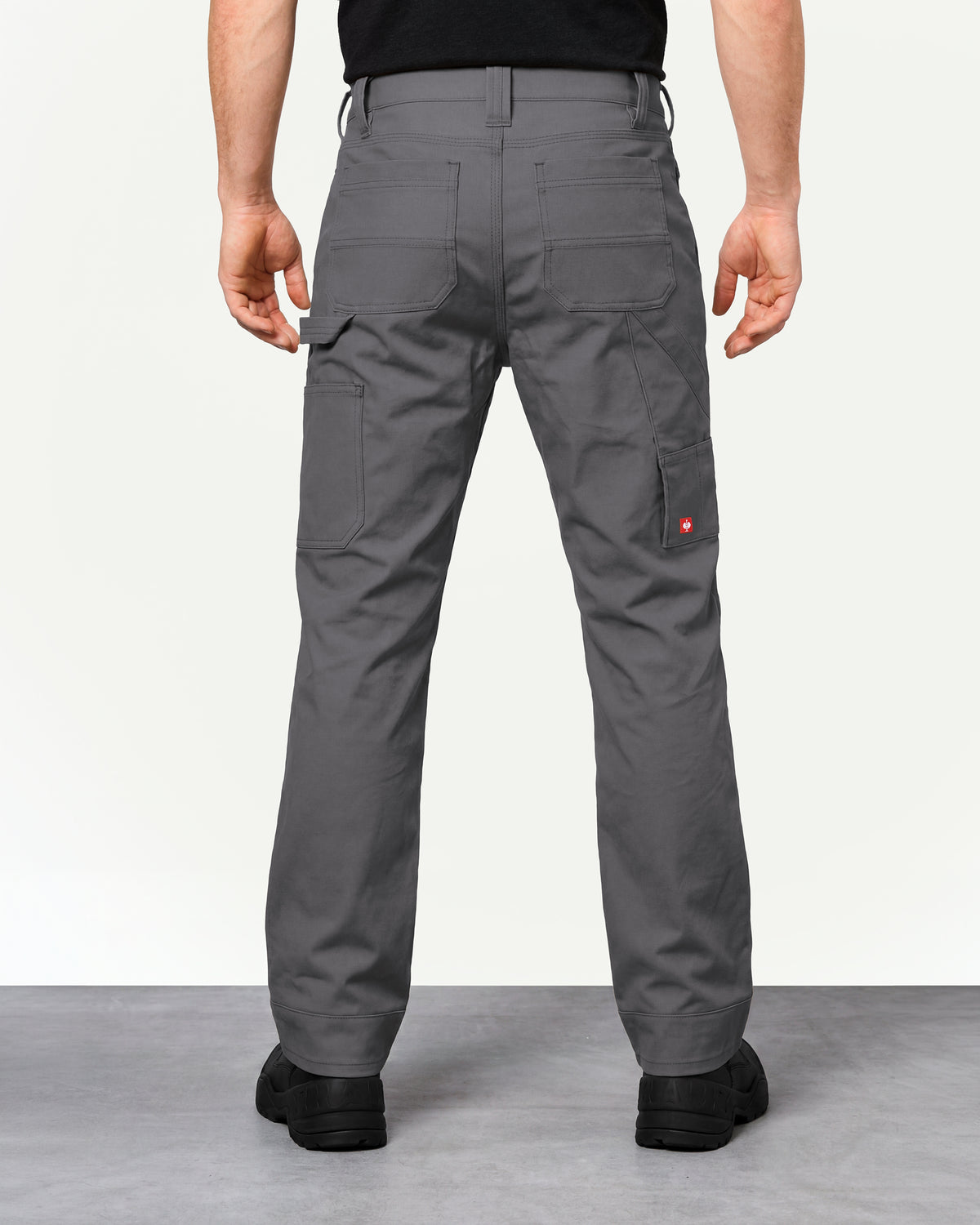 Pocket Protected Work Pants e.s.iconic in carbon gray worn by a model, rear view