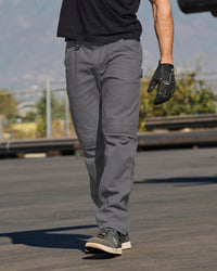 Pocket Protected Work Pants e.s.iconic in carbon gray worn in a work setting