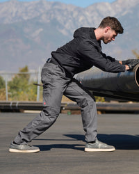 Pocket Protected Work Pants e.s.iconic in carbon gray in use, showing fit and movement